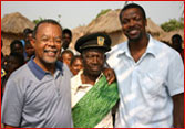 Photo of Henry Louis Gates, Jr., Chris Tucker, and the chief of the Anglolan village whose population, genetically, shares close ancestry with Tucker